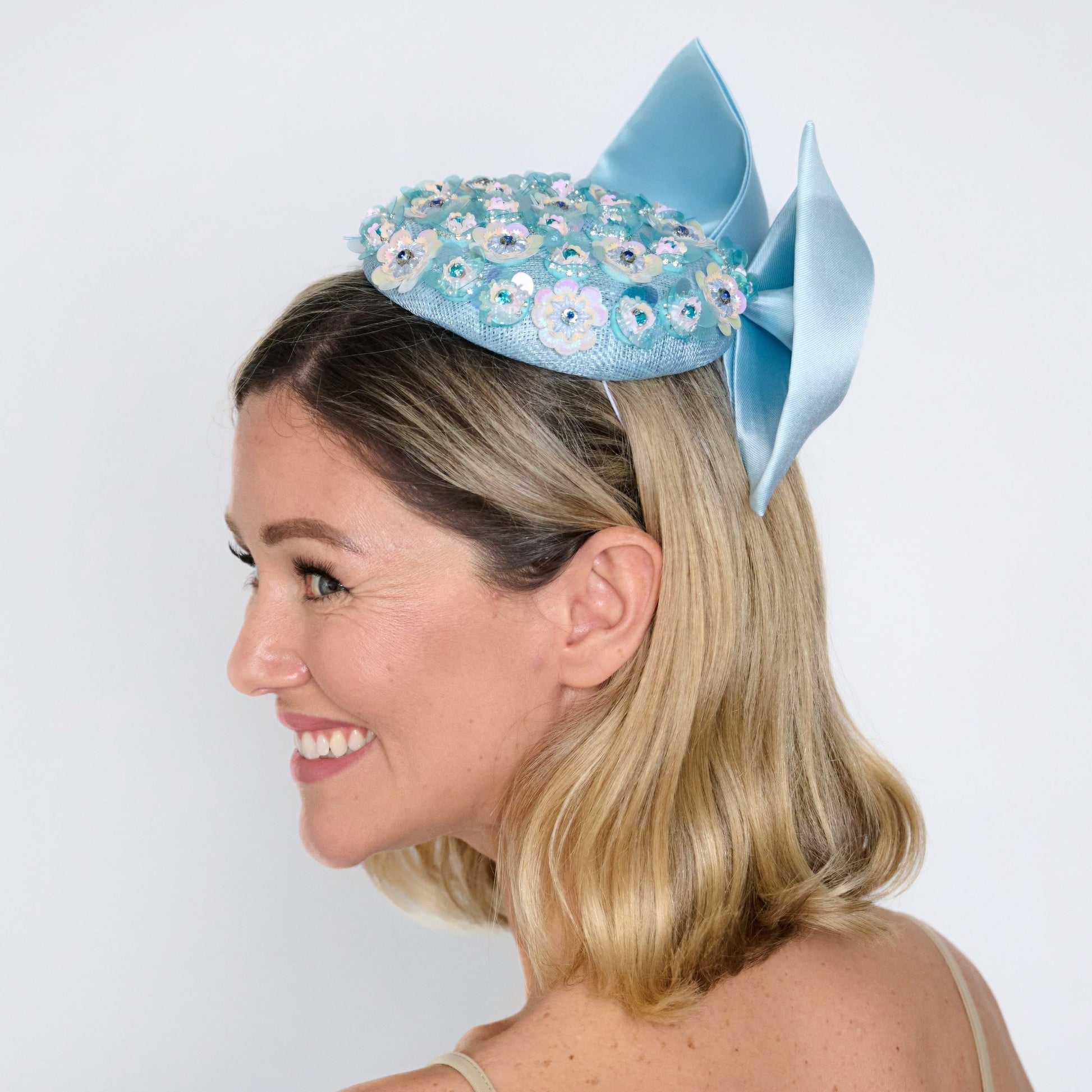 blue spring racing hat with bow from side